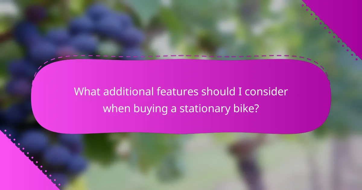What additional features should I consider when buying a stationary bike?